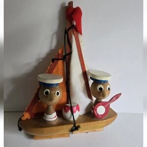 Wood Figurine On Boat Vintage